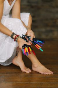 Woman's hands holding markers