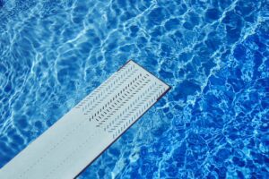 Diving board in swimming pool - Photo by Markus Spiske on Unsplash